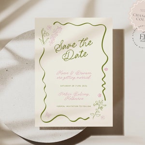 Può includere: Carta di "Save the Date" con un design floreale verde e bianco. Il testo recita "Save the Date" con i nomi Maeve & Branson e la data sabato 29 giugno 2024. La posizione è indicata come Postics Balcony, Melbourne.