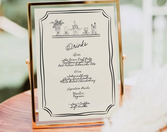 May include: A gold-framed sign with a white background lists a variety of drinks, including beer, wine, and signature cocktails. The sign is decorated with a simple line drawing of a bottle of wine, glasses, and candles.