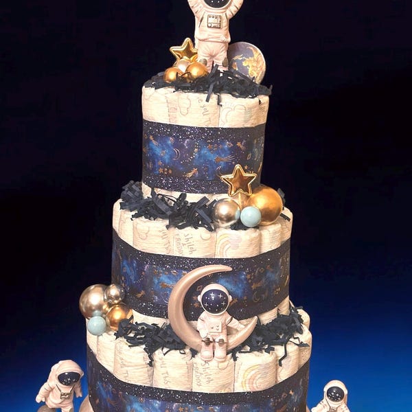 Pastel de pañales de astronauta: Centro de mesa para baby shower con temática espacial