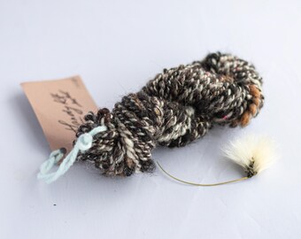 Brown and grey hand-spun  2ply art yarn for weaving, textile and fiber crafts.