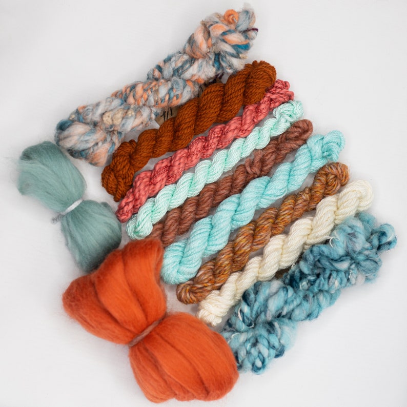 green and rust tone handspun art yarn bundle .Weaving textile fiber pack. Blue,teal