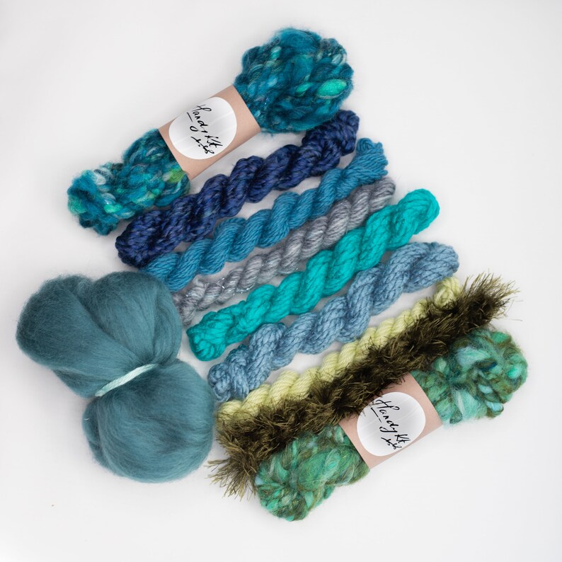 green and rust tone handspun art yarn bundle .Weaving textile fiber pack. Blue,teal