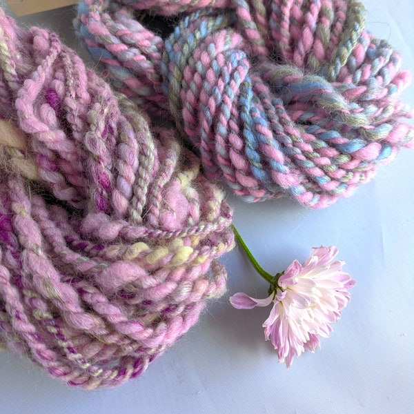 Pink grey blue handspun art yarn for weaving textile and fiber crafts.