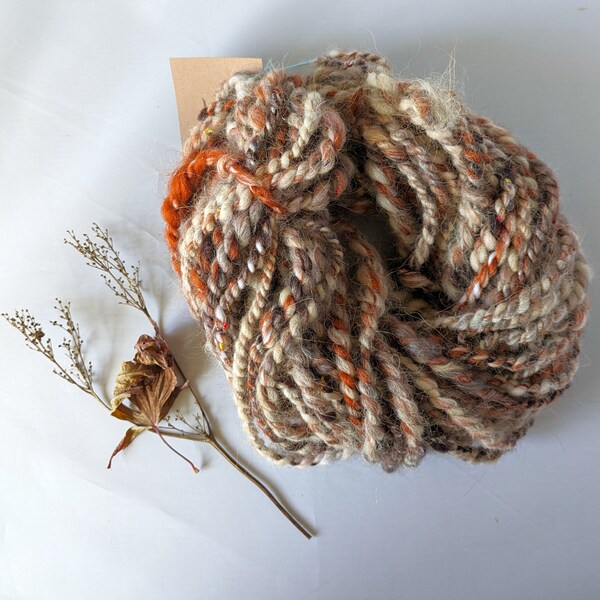 Beige brown rust wool llama handspun art yarn for weaving , textile and fiber crafts.