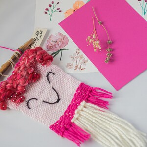 Bright pink  handwoven wall hanging.