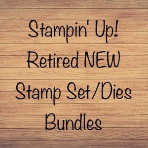 May include: Text on a wooden background reads "Stampin' Up! Retired NEW Stamp Set/Dies Bundles". The text is in a handwritten style, in black, against a light brown wood grain.