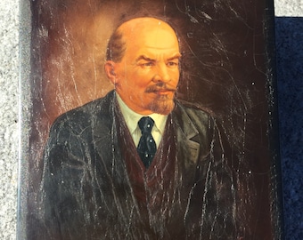 May include: A vintage portrait painting of a man with a beard and mustache, wearing a dark suit, white shirt, and a dark tie with white polka dots. The painting is on a dark wooden frame.