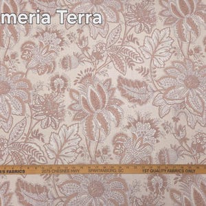 May include: Fabric with a floral pattern in shades of beige and dusty rose. The design features large, stylized flowers and leaves. The text "Plumeria Terra" is at the top. A ruler is at the bottom with the text "MARTHA'S FABRICS".