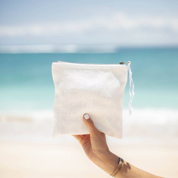 Pochette en couleur lin blanc et  couleur naturel avec fermeture éclair. Parfait sac de maquillage