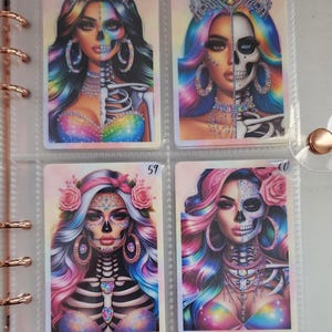 May include: Four colorful cards with images of women with half of their face as a skull and half as a human. The cards are numbered 57, 58, 57, and 60.