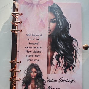 May include: Pink planner with a rose gold spiral binding and a clear cover. The planner features a watercolor illustration of a woman with long black hair. Text on the planner reads "See beyond limits, live beyond expectations. New visions spark new ventures." and "Hottie Savings Challenge."