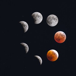 May include: A series of eight images showing the phases of a lunar eclipse. The moon is shown in various stages of being covered by the Earth's shadow, from a sliver of light to a full red eclipse.