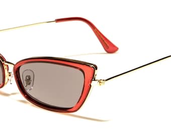 May include: Red cat-eye sunglasses with gold metal frames and dark gray lenses.