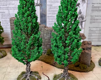 5 model fir trees, for fantasy scenery fo TTRPG, and wargaming.