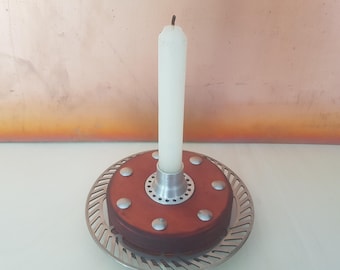 Unique candlestick candle holder made from a wooden bicycle hub brake disc (upcycled).