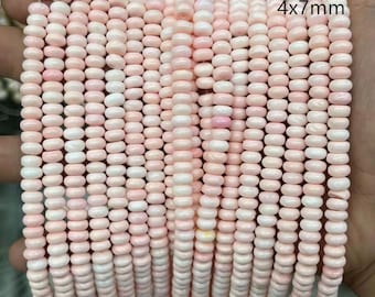 May include: Strands of pink and white beads, each measuring 4x7mm, are displayed. The beads have a smooth, rounded shape and are strung together, creating a textured surface. The image includes the text "color-1" and "4x7mm".
