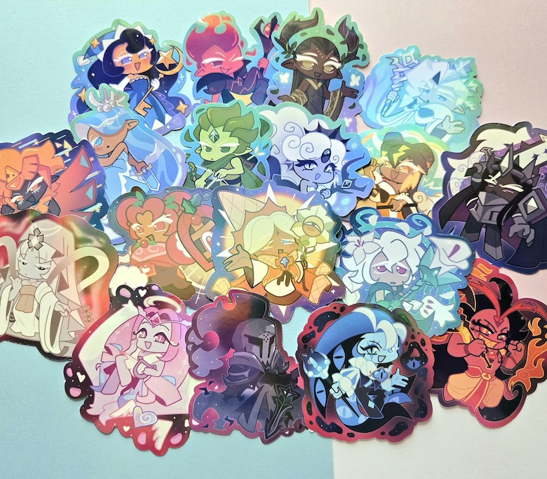 May include: A collection of holographic stickers featuring various stylized cartoon characters with diverse hair colors, outfits, and expressions. The stickers display vibrant hues including blue, pink, green, and purple, with a shimmering finish.