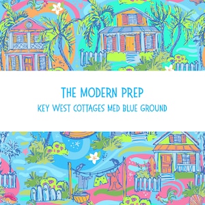 May include: A colorful illustration featuring Key West cottages, palm trees, and laundry hanging on a clothesline. The design includes the text "THE MODERN PREP" and "KEY WEST COTTAGES MED BLUE GROUND" on a medium blue background.