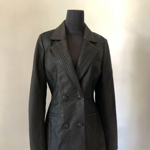 May include: A black snakeskin double-breasted blazer with a classic tailored fit.