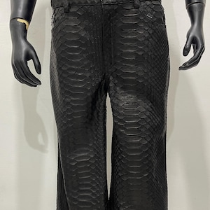 May include: Black leather trousers with a snakeskin pattern.