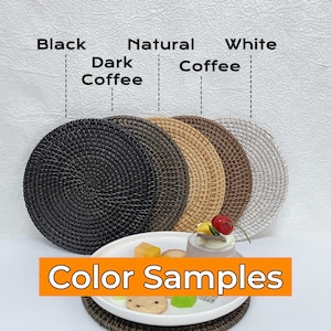 May include: Color samples of round woven placemats in black, dark coffee, natural coffee, and white. The text "Color Samples" is displayed below the placemats.