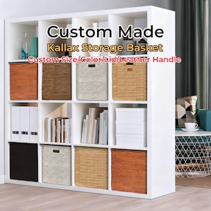 May include: A white storage unit with multiple cubbies, each containing a woven basket in various colors, including orange, brown, and beige. The text "Custom Made Kallax Storage Basket" is displayed at the top, indicating a customizable storage solution.