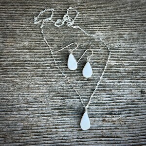 Healing Crystal Jewelry - This white jasper jewelry set is more than just an accessory—it's a healing stone set designed to bring balance and peace. White jasper is known for its calming and grounding energy, making this unique gift for her perfect for those who practice energy healing. Handcrafted on Martha’s Vineyard, this boho jewelry set blends natural elegance with spiritual significance. It is a beautiful energy healing gift for her.