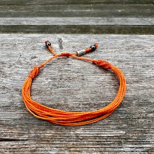 Orange awareness jewelry for self harm awareness. Orange awareness string bracelet size adjustable formed, women and children. Handmade orange awareness bracelet by RumiSumaq