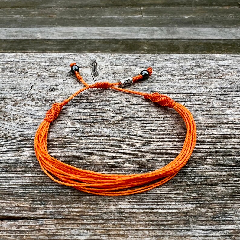 Orange awareness jewelry for self harm awareness. Orange awareness string bracelet size adjustable formed, women and children. Handmade orange awareness bracelet by RumiSumaq