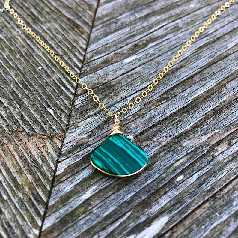 Green gemstone triangle pendant and earring set, handmade by Rumi Sumaq, featuring natural malachite stones on a delicate gold-filled or sterling silver chain. A sophisticated yet minimalist jewelry set, ideal for layering or wearing solo. This malachite necklace and earring set makes a beautiful gift for Christmas, Valentine’s Day, or Mother’s Day, offering both style and spiritual significance. Malachite Jewelry Set | Malachite Earrings | Malachite Necklace | Bday Gift for Her