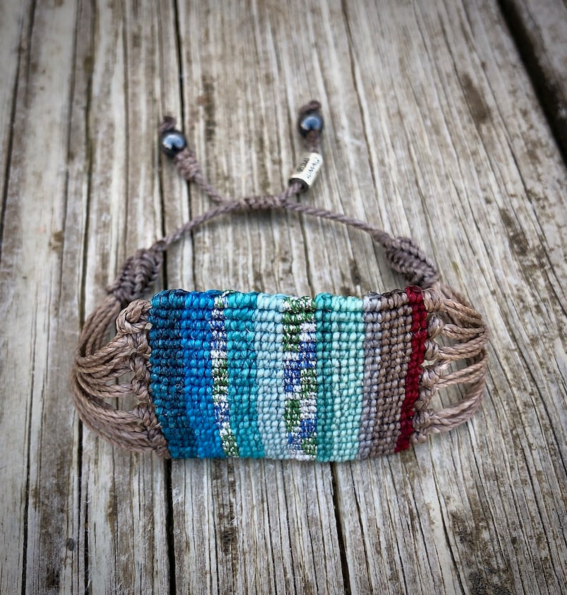 Striped boho bracelet, handwoven in colorful macrame for a bold statement. This wide women’s bracelet is perfect as hippie jewelry or a unique festival accessory. The intricate knotting makes it a standout piece of macrame jewelry for teen girls and women alike. A thoughtful teenage girl gift or bohemian gift for teens. Boho bracelet woven with durable threads for a lasting handmade touch. Rumi Sumaq artisan jewelry, women’s woven jewelry, boho gift for women.