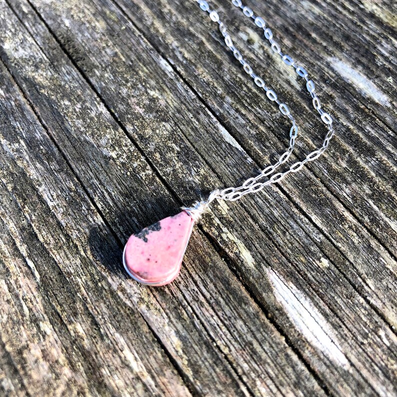 Tiny pink necklace with Rhodonite stone in teardrop shape suspends from dainty Sterling silver chain. Jewelry gift for mom from son handmade by Rumi Sumaq Jewelry.