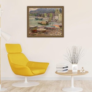 May include: A framed painting depicting a lakeside scene with boats docked along the shore. The painting features a variety of colors, including blues, greens, and browns. The boats are a mix of wooden and metal, and some have colorful sails.
