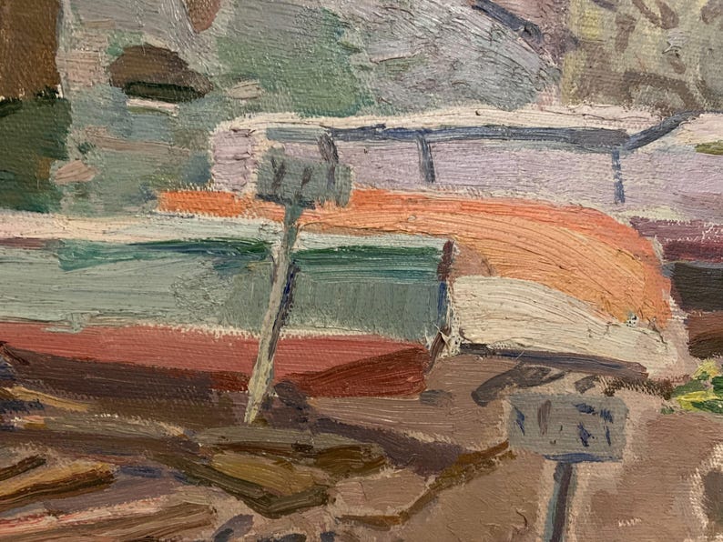 May include: A close-up of a painting depicting a boat with a red, orange, and white striped awning. The boat is docked at a pier with a wooden post and a sign that reads "NEXT".
