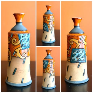 Orange Ceramic Bottle with Green squares and yellow spirals.Ceramics and Pottery, Handmade and Hand Painted Ceramics, Art pottery