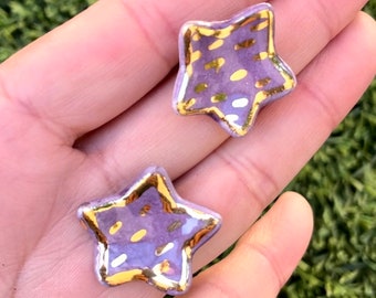 Handmade Purple Porcelain little star’s earrings with 22K gold luster rim.