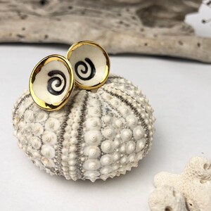 Small white porcelain earrings with black spiral and golden luster.Valentines Day Gift.