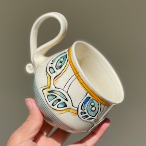 Porcelain handmade Tea/Coffee mug with blue leaves.Eco-Friendly ceramic mug.Wheel Thrown Pottery Mug .