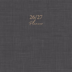 May include: A dark gray planner with a textured fabric-like appearance. The text "26/27 Planner" is in a gold script font. The bottom of the planner reads "JULY 2026-JUNE 2027" in a gold serif font.