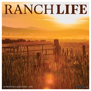May include: A square calendar with the words "RANCHLIFE" in large brown letters. The image is a sunset over a field with a fence and cattails in the foreground. The text "18-MONTH CALENDAR • 2026" is at the bottom.