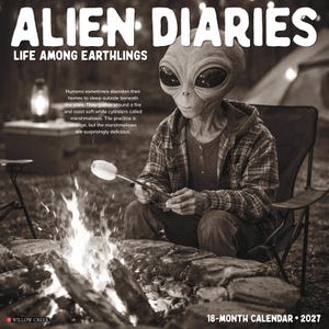 May include: A 2027 18-month calendar titled Alien Diaries: Life Among Earthlings. The cover features a black and white image of an alien wearing a plaid shirt and hoodie, roasting a marshmallow over a campfire. Text includes the title, a descriptive paragraph, and the Willow Creek logo.