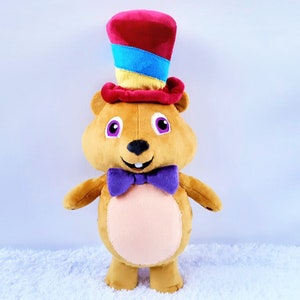 Stuffed hamster plush sculpture in a hat
