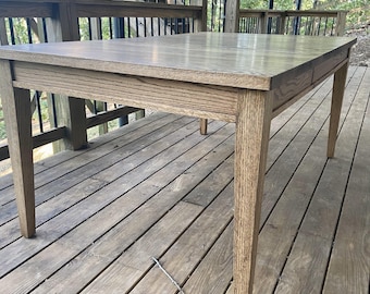 Oak Tapered leg Extension table. Featuring clean lines for an elegant look. Also available in Maple, Walnut or Cherry.