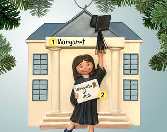 Graduate in Front of School - Female Brown Hair - Ornament - Diploma - High School - College - Graduation - Degree - Black Cap and Gown