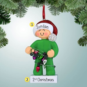 Young Child Wrapped in Lights - Personalized Christmas Ornament - Decorating the Tree - Pajamas - Santa Hat - Perfect Handwriting