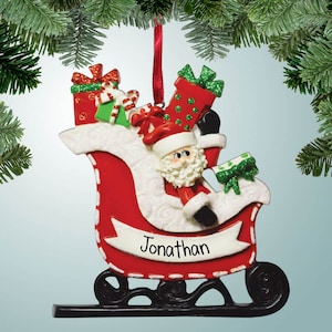Gepersonaliseerde kerstmanslee met cadeautjes Kerstversiering - kerstavond - rendier - dak - cadeaus - veel speelgoed