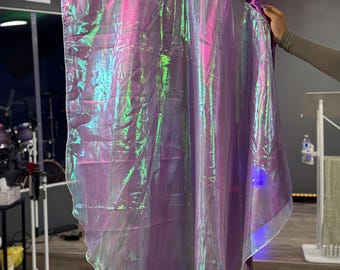 May include: A flowing, iridescent purple flag with a shimmering, holographic effect. The flag has a rounded top edge with a darker purple trim and a sheer, white border. The fabric reflects green and blue hues.