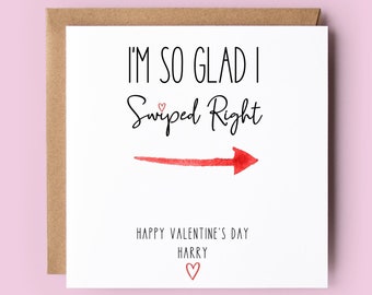 May include: White card with black text that reads "I'm so glad I Swiped Right" with a red arrow pointing to the right. The text "Happy Valentine's Day Harry" is below the arrow with a small heart.
