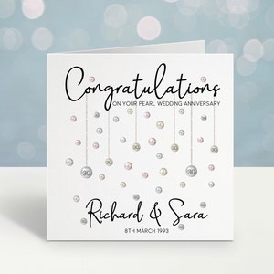 Congratulations on your pearl wedding anniversary. Beautiful hanging pearls and personalised with the couples name and date.