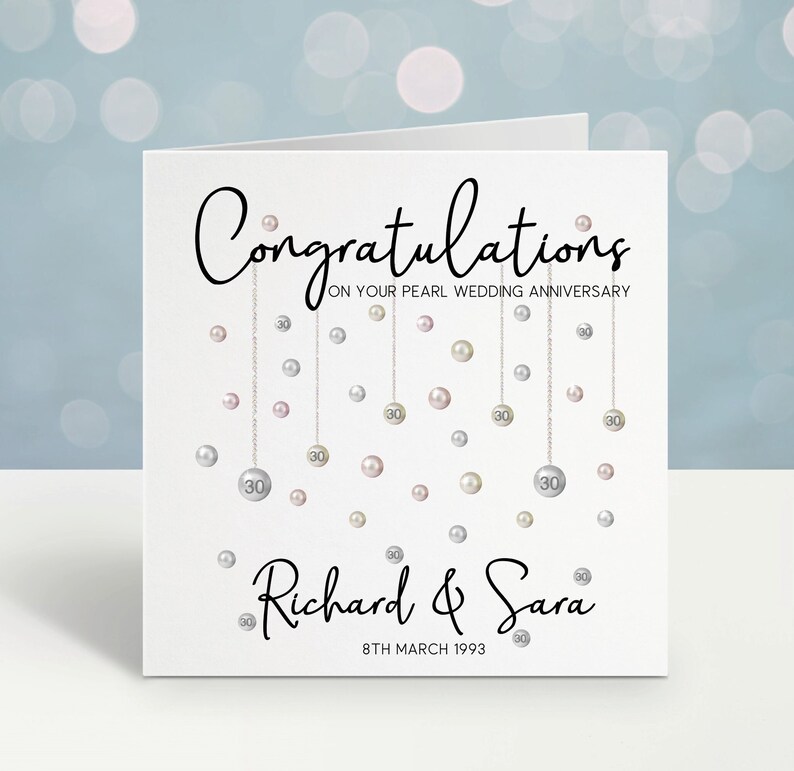 Congratulations on your pearl wedding anniversary. Beautiful hanging pearls and personalised with the couples name and date.